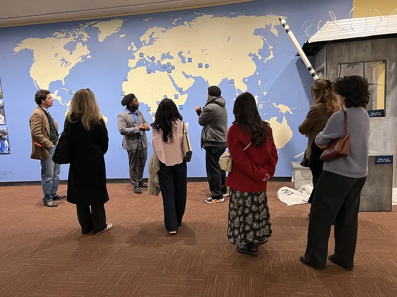 Global Thought students are on field trip reviewing image of global map 